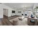 Bright and spacious living room with ample seating, a stylish rug, and neutral decor at 1040 20Th St, Orlando, FL 32805