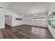 Bright living room with hardwood floors, large windows, and a modern ceiling fan at 1040 20Th St, Orlando, FL 32805