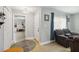 Inviting foyer features tile flooring, a coat closet, and seamless access to the attached garage for added convenience at 10934 Tangora St, Orlando, FL 32825