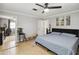 This main bedroom is spacious, features a ceiling fan, ensuite and walk-in closet at 10934 Tangora St, Orlando, FL 32825