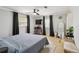 Cozy main bedroom featuring a ceiling fan, neutral decor, and abundant natural light for a relaxing ambiance at 10934 Tangora St, Orlando, FL 32825