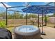 Enjoy outdoor living with a screened patio featuring a hot tub and scenic backyard views at 10934 Tangora St, Orlando, FL 32825