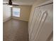 Bedroom featuring plank flooring, a ceiling fan, and a double-door closet at 1115 Fidelma Ct, Orlando, FL 32824