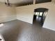 Spacious living room featuring tile flooring, neutral walls, an arched entryway, and contemporary lighting at 1115 Fidelma Ct, Orlando, FL 32824