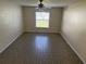 Neutral living room features tile flooring, neutral paint, and a ceiling fan at 1115 Fidelma Ct, Orlando, FL 32824