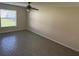 Large living room features tile flooring, neutral paint, and a ceiling fan at 1115 Fidelma Ct, Orlando, FL 32824