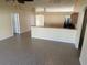 Spacious living room featuring tile floors and easy access to the adjacent kitchen and other rooms at 1115 Fidelma Ct, Orlando, FL 32824