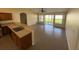 Open living room with tile floors, bright natural light, and seamless access to the kitchen at 1115 Fidelma Ct, Orlando, FL 32824