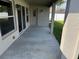 Covered patio with a concrete floor, and a view of the back yard at 1115 Fidelma Ct, Orlando, FL 32824