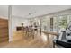 Chic dining area boasts hardwood floors, recessed lighting, and a wall of windows for a bright and airy ambiance at 1130 Washington Ave # 11, Winter Park, FL 32789