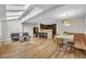 A bright living room with skylights, wood floors, a modern kitchen, and a built-in dining area at 1130 Washington Ave # 11, Winter Park, FL 32789