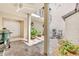Private courtyard patio with stone pavers, a built-in fountain, and outdoor seating at 1130 Washington Ave # 11, Winter Park, FL 32789