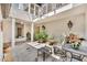 Private courtyard patio with stone pavers, a built-in fountain, and outdoor seating at 1130 Washington Ave # 11, Winter Park, FL 32789