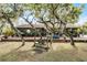 A swing set and large wooden deck make this backyard perfect for entertaining and enjoying a relaxing time at 1200 Auger Dr, New Smyrna Beach, FL 32168