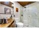 Bathroom featuring unique sink, glass-enclosed shower, and stylish fixtures at 1200 Auger Dr, New Smyrna Beach, FL 32168