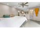 Bedroom featuring ceiling fan, natural light, and unique decorative elements at 1200 Auger Dr, New Smyrna Beach, FL 32168