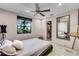 Bedroom with large window, ceiling fan, and access to a walk-in closet at 1200 Auger Dr, New Smyrna Beach, FL 32168