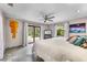 Bright bedroom with access to patio and large windows for natural light at 1200 Auger Dr, New Smyrna Beach, FL 32168