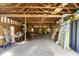 Spacious garage featuring wood framing and ample room for storage, equipment, and parking at 1200 Auger Dr, New Smyrna Beach, FL 32168