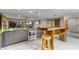 Contemporary kitchen featuring stainless steel appliances, a large island and views to the back yard at 1200 Auger Dr, New Smyrna Beach, FL 32168
