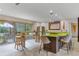 Open kitchen featuring a large island with seating, modern appliances, and sliding doors to outdoor space at 1200 Auger Dr, New Smyrna Beach, FL 32168