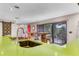 Modern kitchen features bright green countertops, gas range and view to the entryway at 1200 Auger Dr, New Smyrna Beach, FL 32168