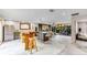 Spacious living room featuring an open layout, high ceilings, and stylish concrete flooring throughout the living space at 1200 Auger Dr, New Smyrna Beach, FL 32168