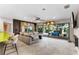 Inviting living room boasts sliding glass doors leading to the deck, and an open layout at 1200 Auger Dr, New Smyrna Beach, FL 32168