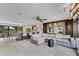 Open concept living room with kitchen bar and view of the backyard patio at 1200 Auger Dr, New Smyrna Beach, FL 32168