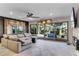 Comfortable living room with an open layout, sliding glass doors leading to the deck, and natural lighting at 1200 Auger Dr, New Smyrna Beach, FL 32168
