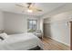 Cozy bedroom features a ceiling fan, closet, and a window overlooking the outdoors at 1210 Maury Rd # 3, Orlando, FL 32804