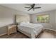 Bright bedroom with a large window, wood-look flooring, and a comfortable bed at 1210 Maury Rd # 3, Orlando, FL 32804