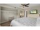Bedroom featuring a ceiling fan, closet, and a desk area for work or study at 1210 Maury Rd # 3, Orlando, FL 32804