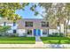 Charming townhome with manicured lawn and inviting blue front doors at 1210 Maury Rd # 3, Orlando, FL 32804