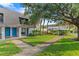 A townhome with mature trees and vibrant green lawn at 1210 Maury Rd # 3, Orlando, FL 32804