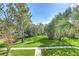Lush landscaping and mature trees enhance the exterior of this well-maintained property at 1210 Maury Rd # 3, Orlando, FL 32804
