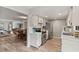 Bright kitchen features stainless steel appliances, white cabinetry and wood-look flooring at 1210 Maury Rd # 3, Orlando, FL 32804