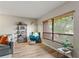 Cozy living area with bookshelf and large window at 1210 Maury Rd # 3, Orlando, FL 32804