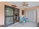 Inviting screened patio with seating area, ceiling fan, and access to the kitchen at 1210 Maury Rd # 3, Orlando, FL 32804