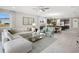 Bright and open living area with contemporary decor, tile floors, and stylish furnishings at 12966 Promise Pl, Orlando, FL 32832