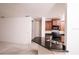 Modern kitchen features dark wood cabinetry, granite countertops, and stainless steel appliances at 145 Palazzo Ln, Kissimmee, FL 34759