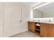 Contemporary bathroom with a double sink vanity, a well-lit mirror and plenty of storage space at 14501 Grove Resort Ave # 2438, Winter Garden, FL 34787