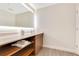 Modern bathroom with a stylish vanity, storage shelves, and an illuminated mirror at 14501 Grove Resort Ave # 2438, Winter Garden, FL 34787
