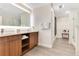 Spa-like bathroom with a double sink vanity, a large mirror with ample storage at 14501 Grove Resort Ave # 2438, Winter Garden, FL 34787