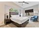 Cozy bedroom featuring a comfortable king-size bed, modern decor, and a relaxing sitting area at 14501 Grove Resort Ave # 2438, Winter Garden, FL 34787