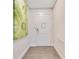 Inviting hallway with wood floors and modern artwork at 14501 Grove Resort Ave # 2438, Winter Garden, FL 34787