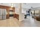 Updated kitchen features stainless steel appliances and wood cabinetry open to the living room at 14501 Grove Resort Ave # 2438, Winter Garden, FL 34787