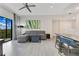 Bright living room with sectional sofa, dining area, and large window at 14501 Grove Resort Ave # 2438, Winter Garden, FL 34787