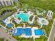 Aerial view of a vibrant resort-style water park featuring pools, slides, and various recreational amenities at 14501 Grove Resort Ave # 2438, Winter Garden, FL 34787