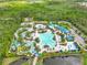 Aerial view of a vibrant resort-style water park featuring pools, slides, and various recreational amenities at 14501 Grove Resort Ave # 2438, Winter Garden, FL 34787